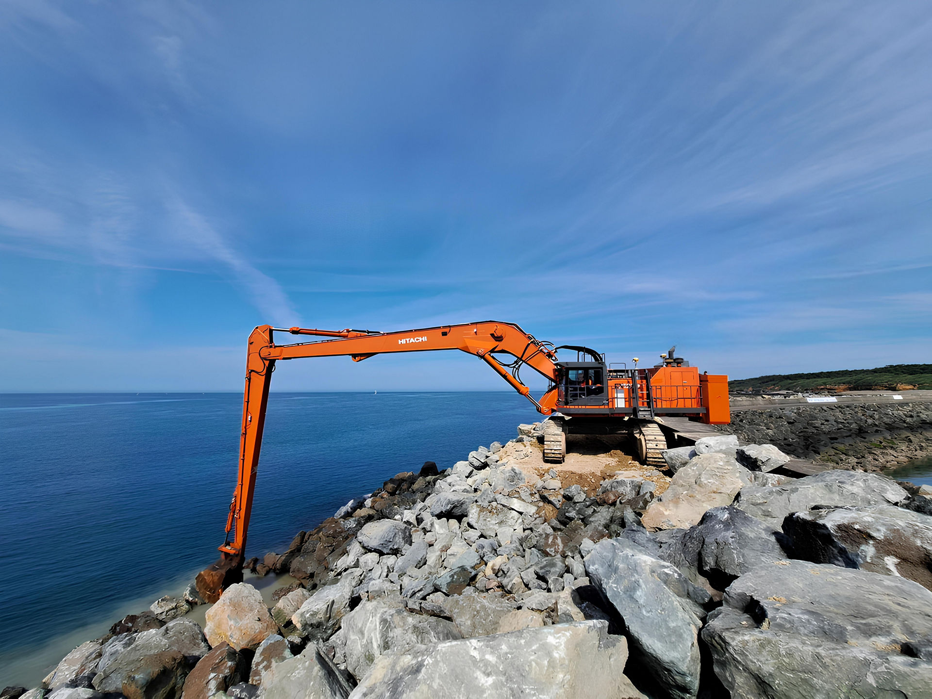 Hitachi Large Excavator Equipped For Coastal Protection Projects