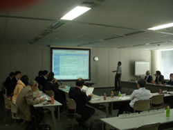 Participants listen intently to the lecture