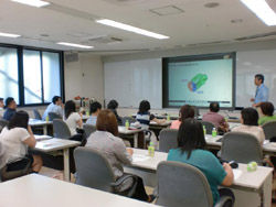 Teachers intently listen to the lecture