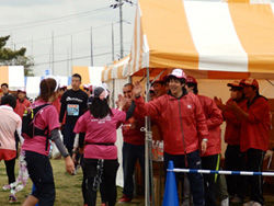 Volunteers greet runners with a smile