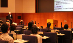 President Tsujimoto giving a presentation