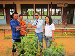 Giving plants we raised to local residents as a present