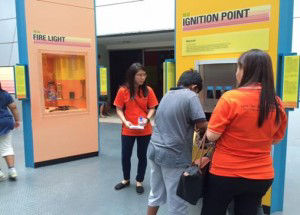 Two volunteers taking care of the kids at the Science Centre