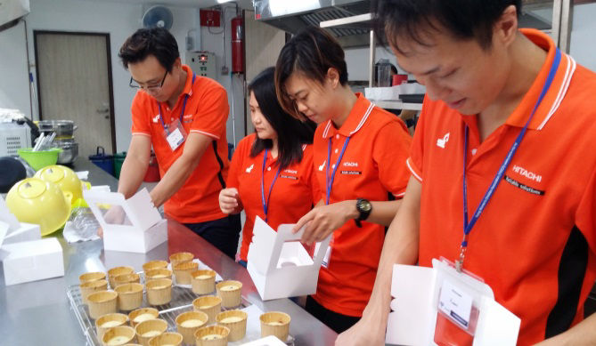 CSR Members busy packing the muffins