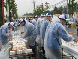 Employees volunteering at a water station