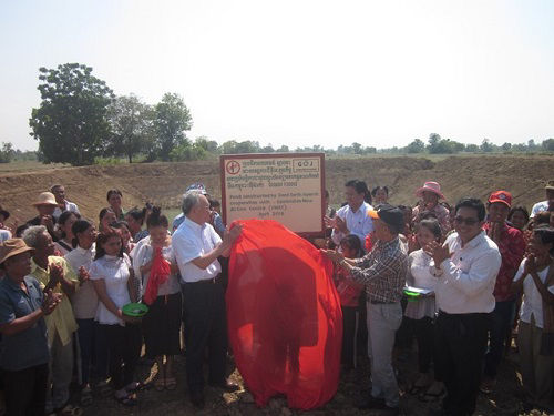 Completed reservoir. Senior Vice President Fujii at center left