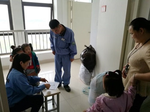 Collecting old clothing at the employee dormitory of Hitachi Construction Machinery (China)