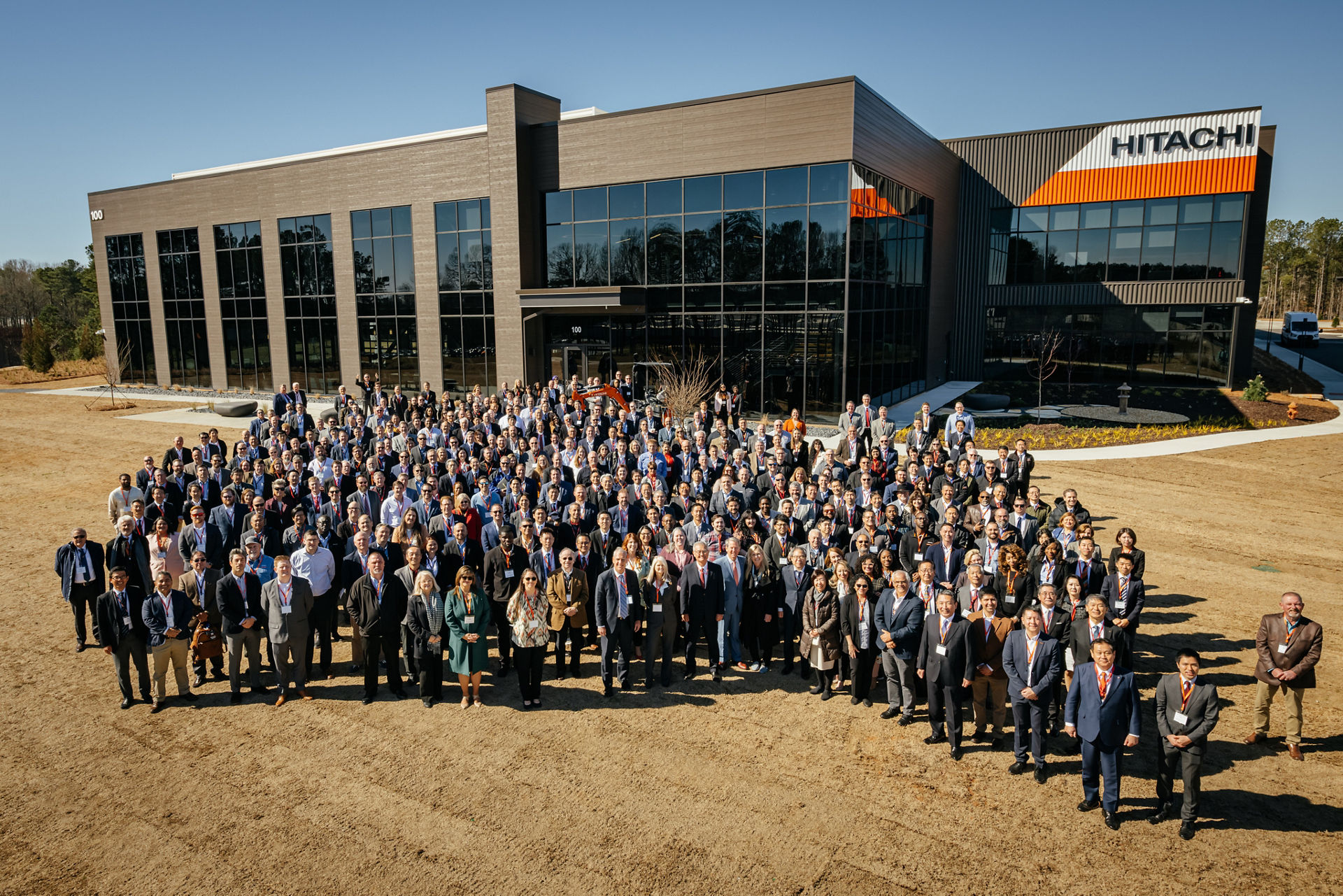 Group photo in front of new headquarters