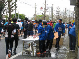 Employees volunteering at a water station