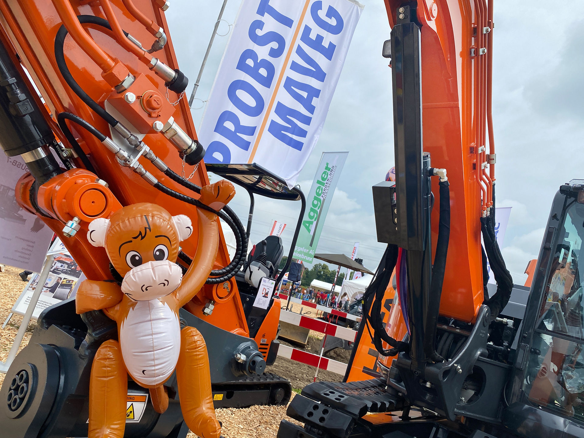 An inflatable monkey attached to a Hitachi excavator at Oga Fair, Switzerland