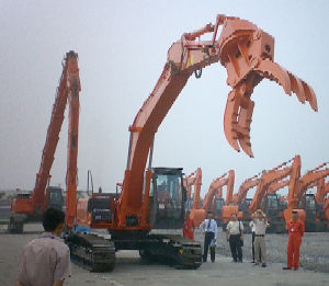 ZAXIS230LC with Material Handling Attachment (Front), ZAXIS450LC with 26 m Long Reach Demolition Front (Rear)