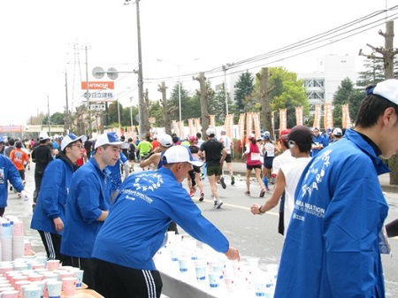 Employees volunteering at a water station