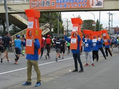 Cheering on runners from the roadside