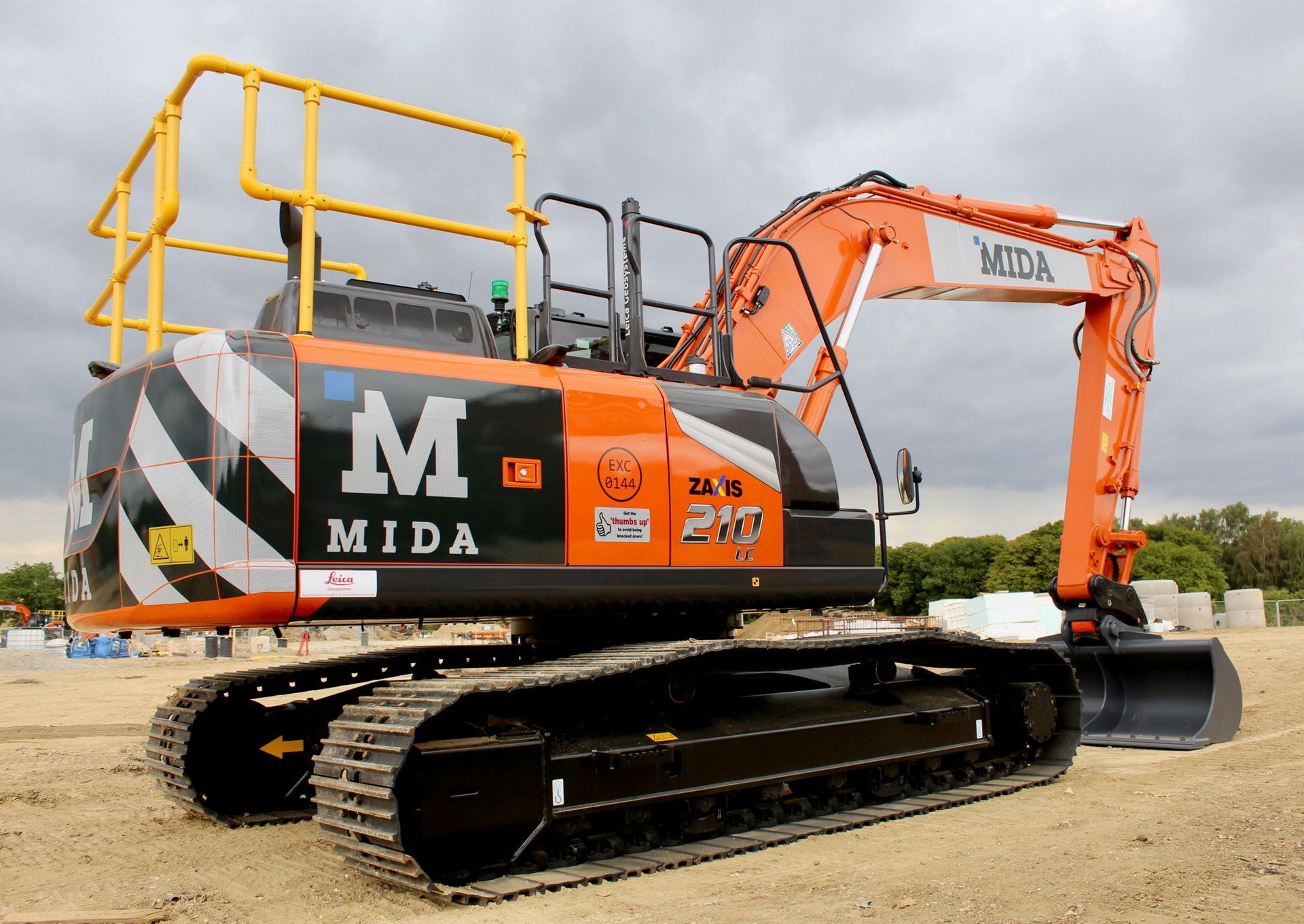 an orange hitachi machine digging quinn 